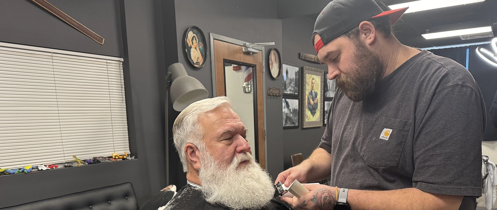 Milo Young, Master Barber and owner of Pendergast Barbershop in Kansas City; Milo Young providing a traditional barbering experience at Pendergast Barbershop